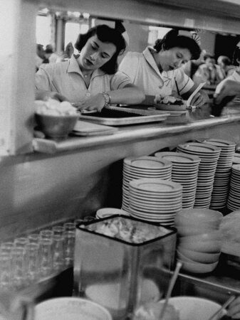 Vintage photo: two waitresses working at a lunch counter